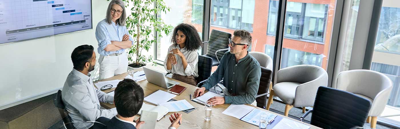 A group of people having a conversation in a business meeting