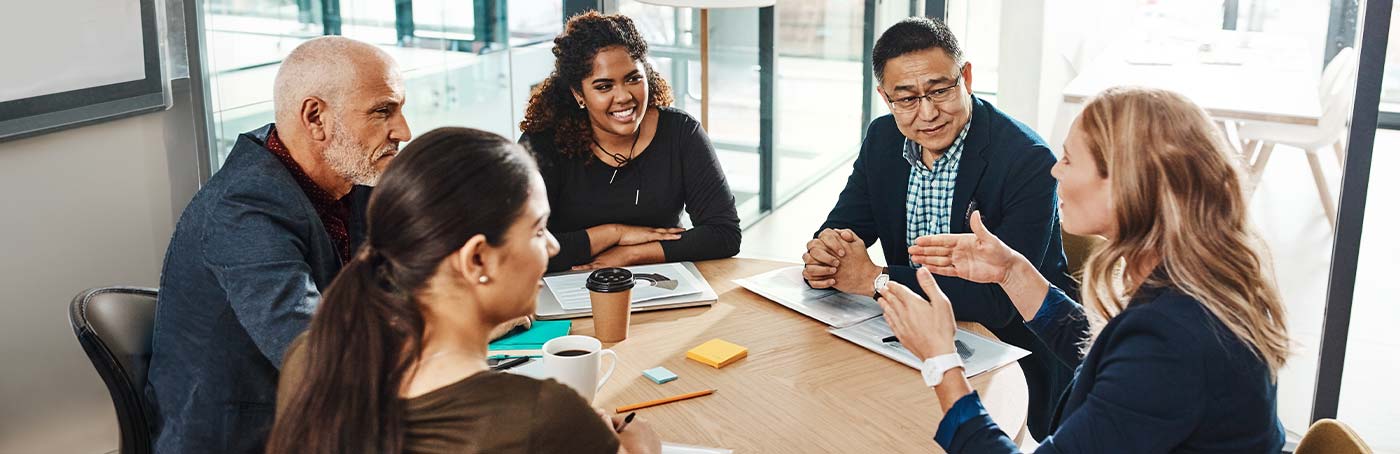 A diverse group of people sitting together in a meeting