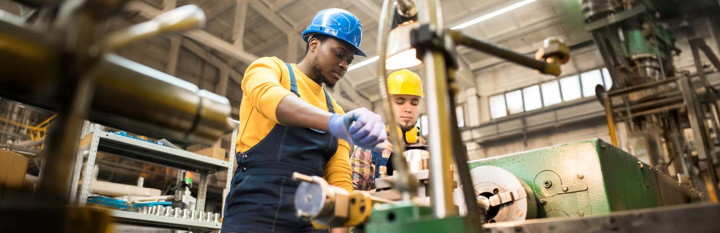 Picture of two men working in a manufacturing facility